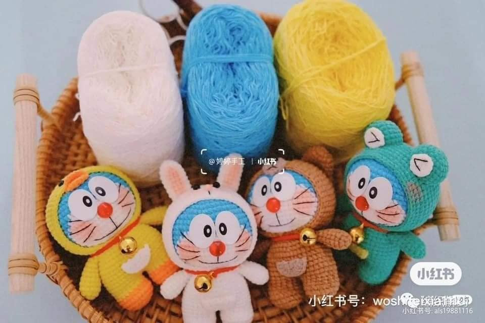 Doraemon crochet pattern wearing a pink long-eared rabbit hat.