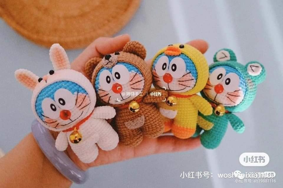 Doraemon crochet pattern wearing a pink long-eared rabbit hat.