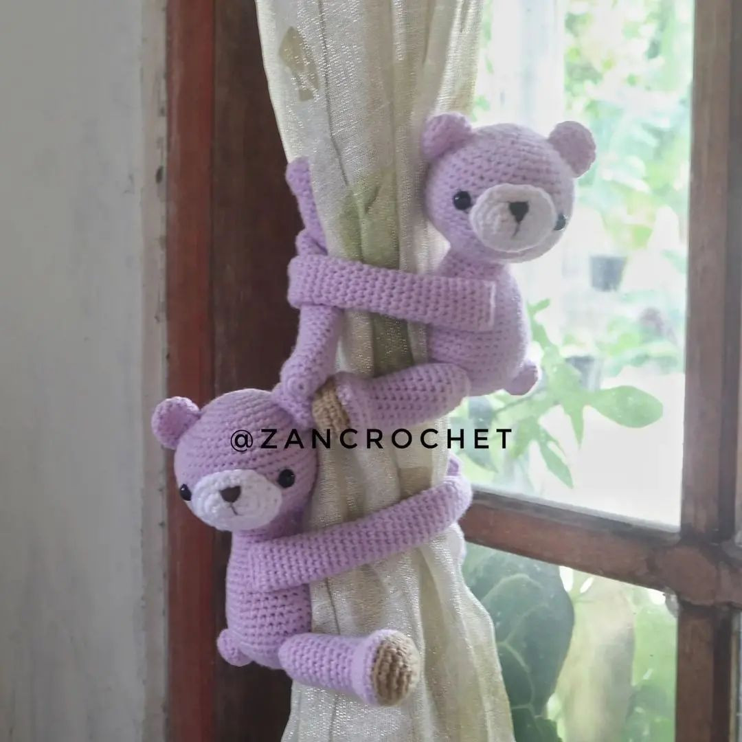crochet bear climbs curtains
