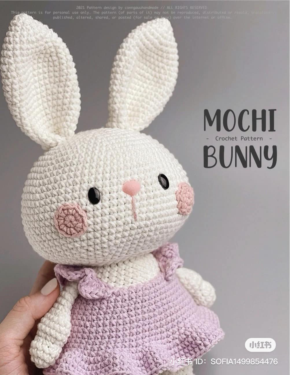 crochet pattern long-eared rabbit, wearing a pink dress, brown muzzle rabbit, wearing a bow.