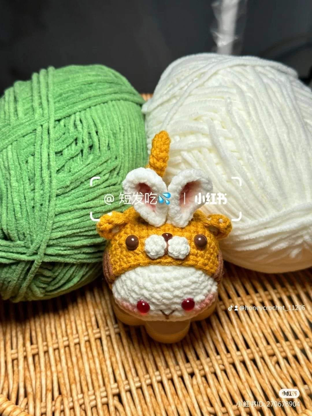 crochet pattern rabbit dumplings wearing tiger hats.