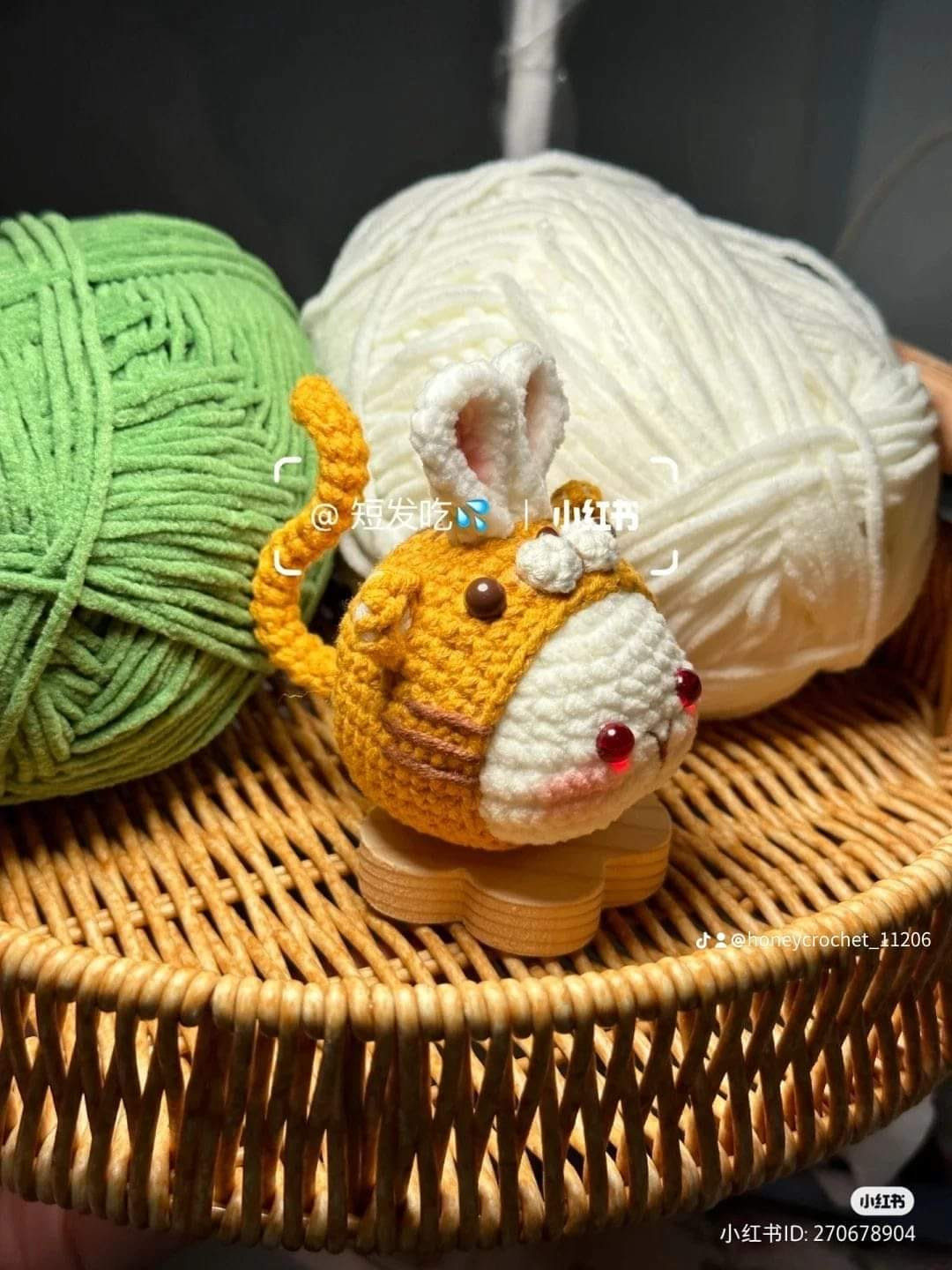 crochet pattern rabbit dumplings wearing tiger hats.