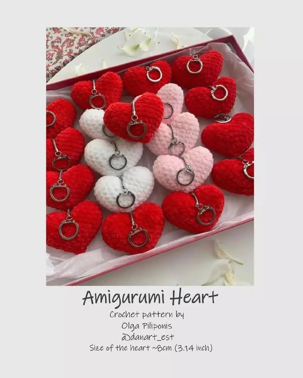 Heart-shaped keychain, white, red.