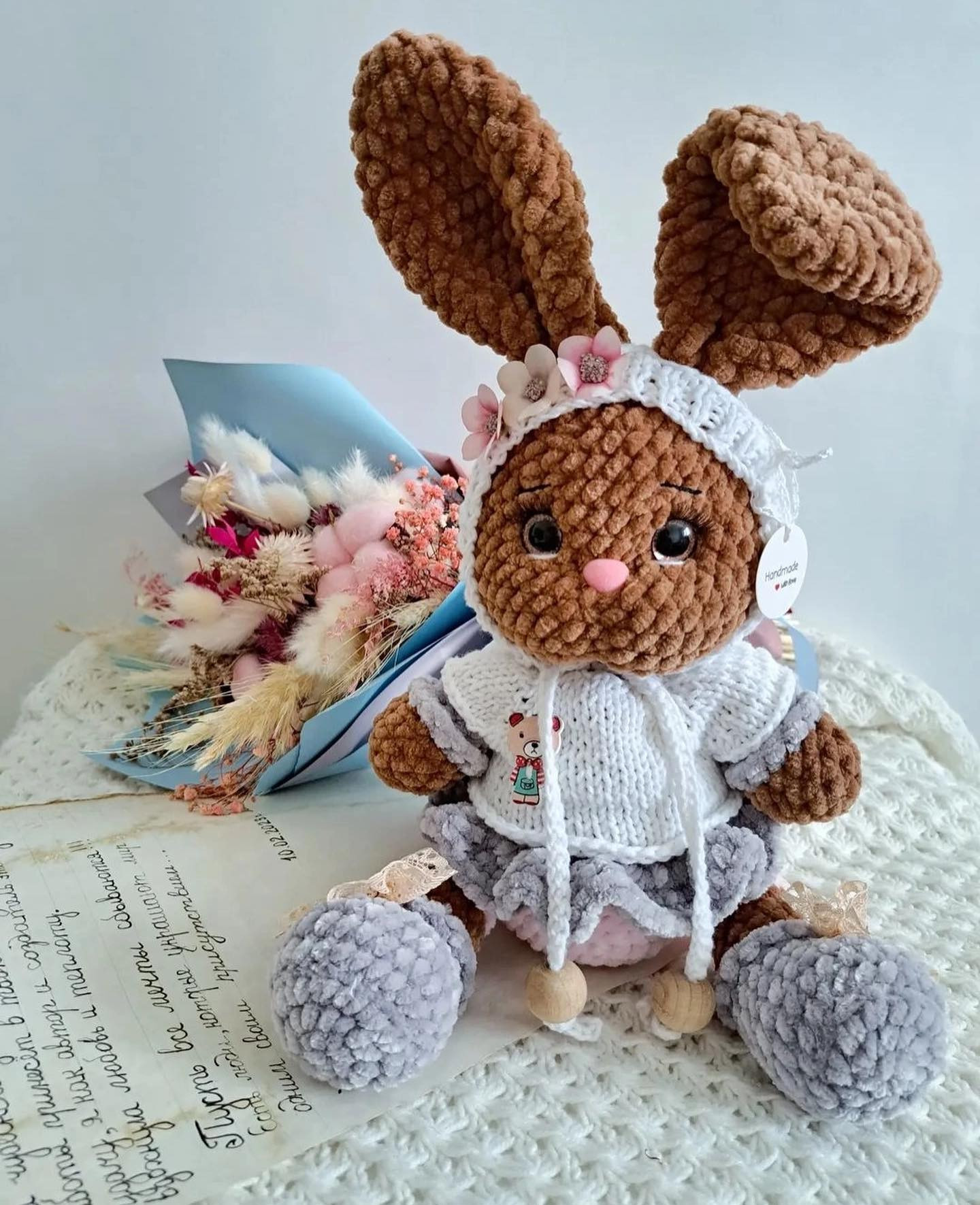 brown rabbit and big-eared gray rabbit, wearing white shirt, white hat free crochet pattern