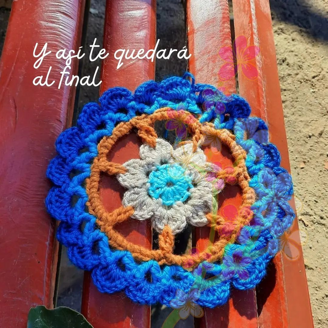 free crochet circular pattern with petals at the edge.