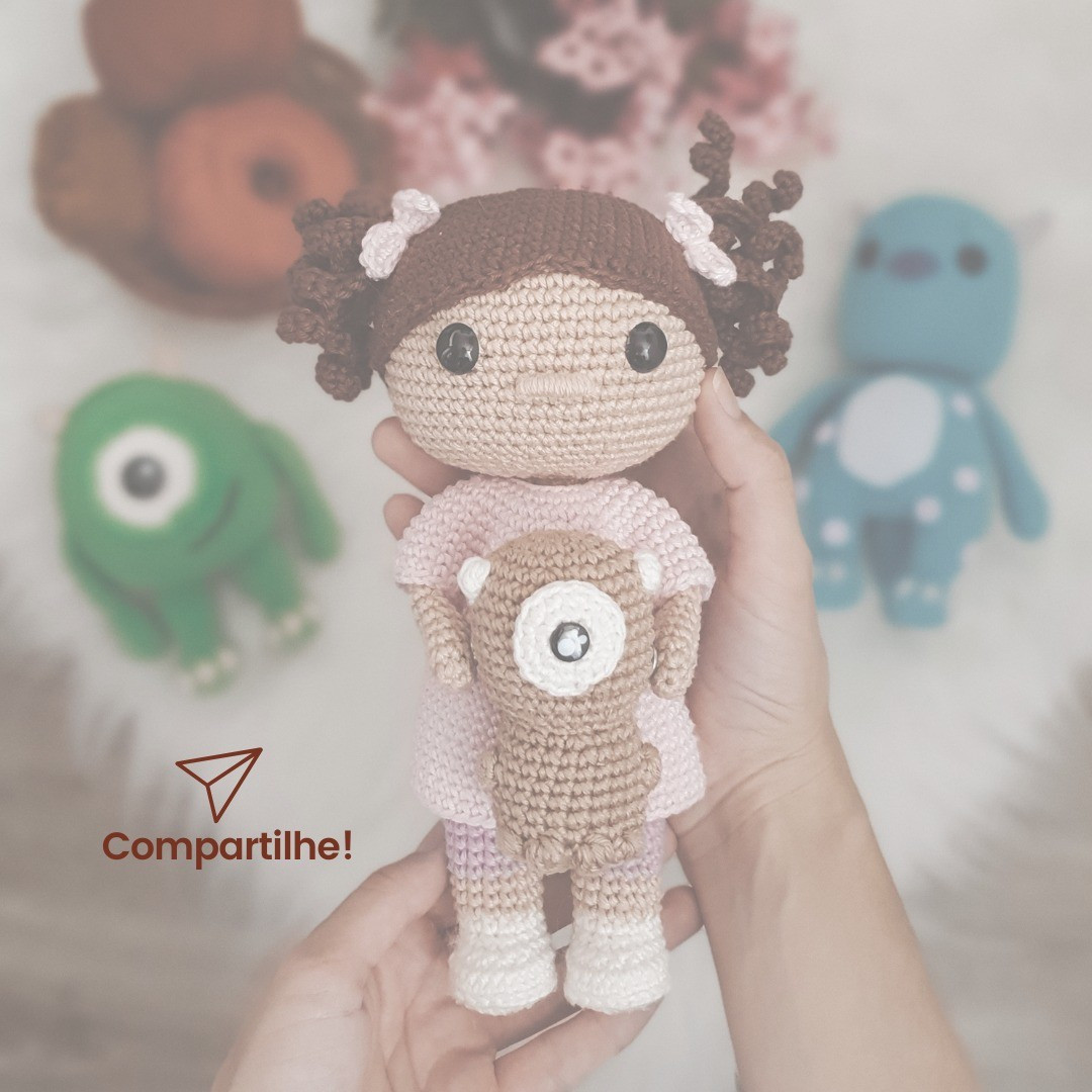 free crochet pattern brown haired doll wearing pink dress.