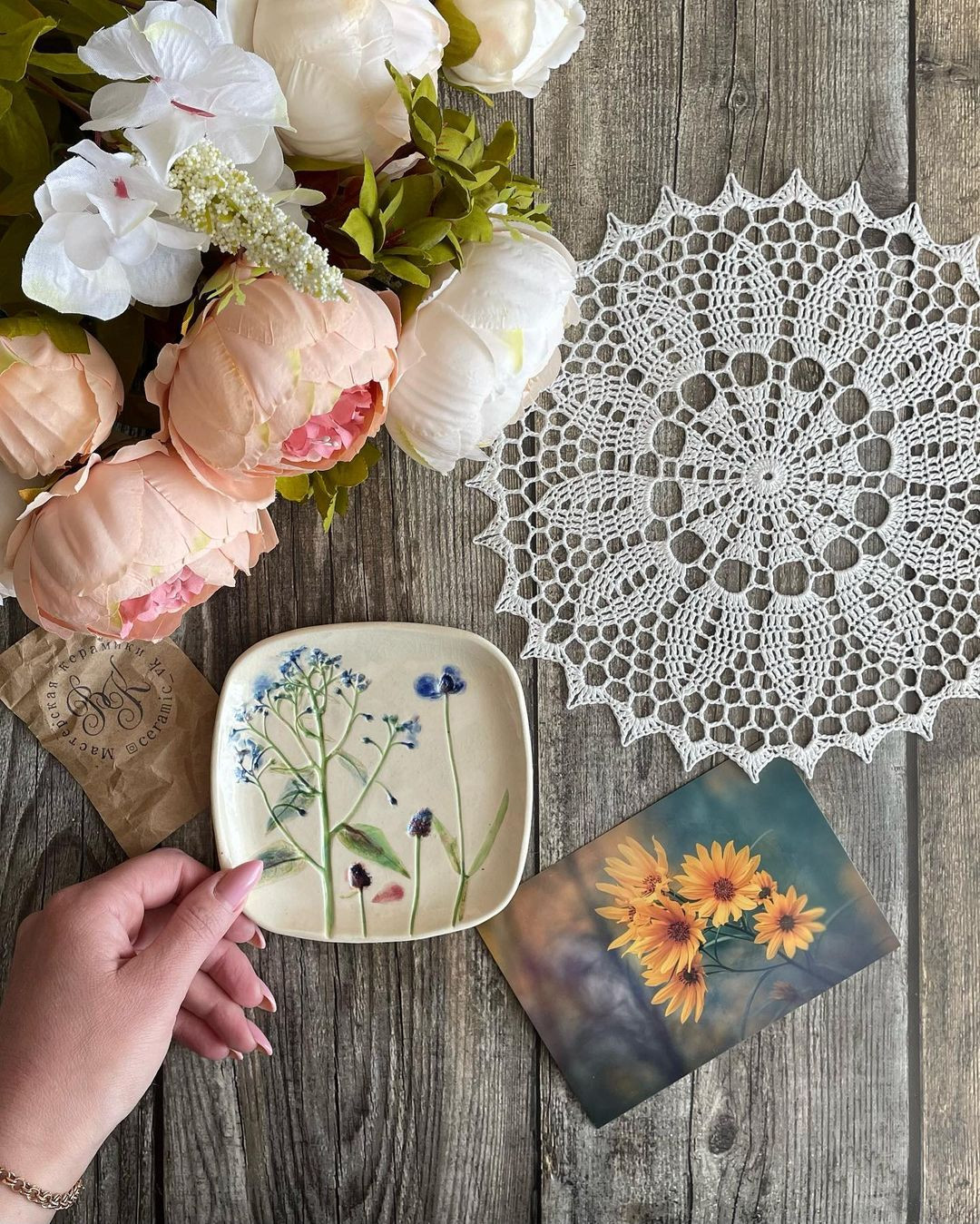 free crochet pattern circle with twelve leaves in the center, and a circle in the center.