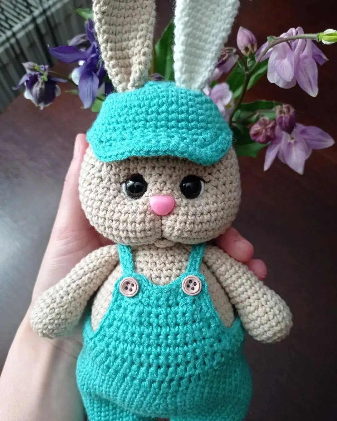 free crochet pattern rabbit wearing blue hat wearing blue overalls