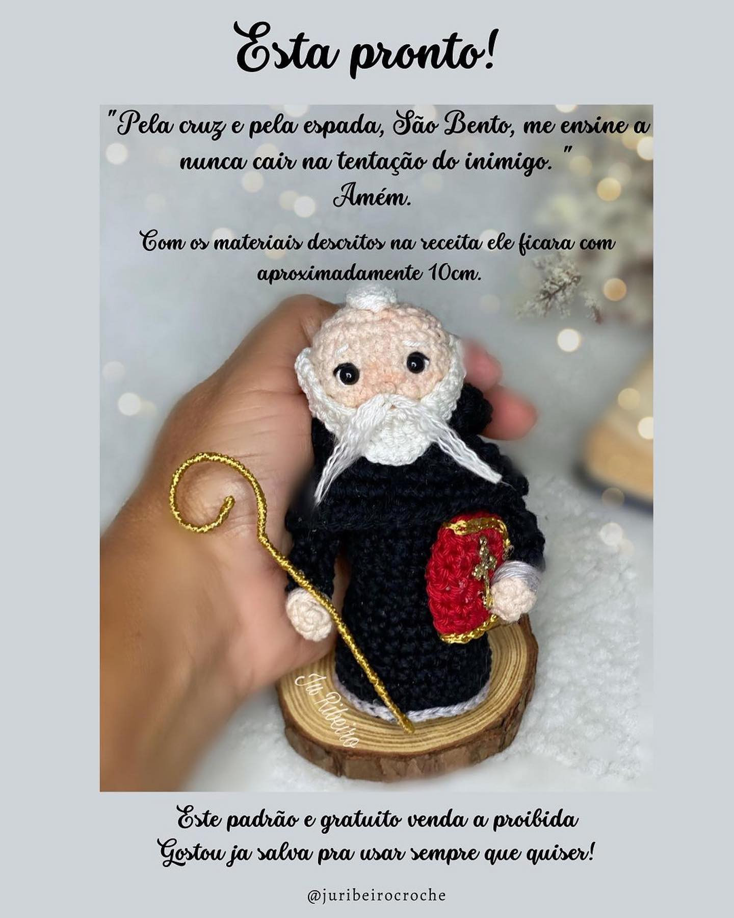 free crochet pattern white bearded saint, wearing black robe.