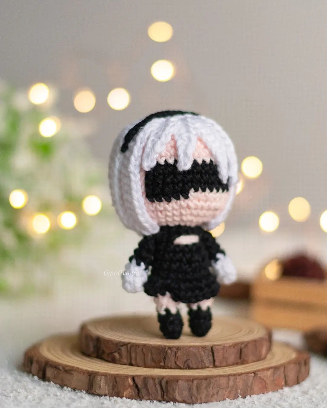 free crochet pattern white haired doll wearing black dress.