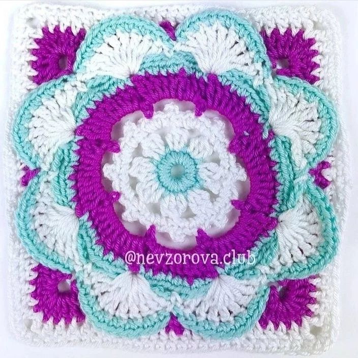 square decorated in blue and purple, white crochet pattern