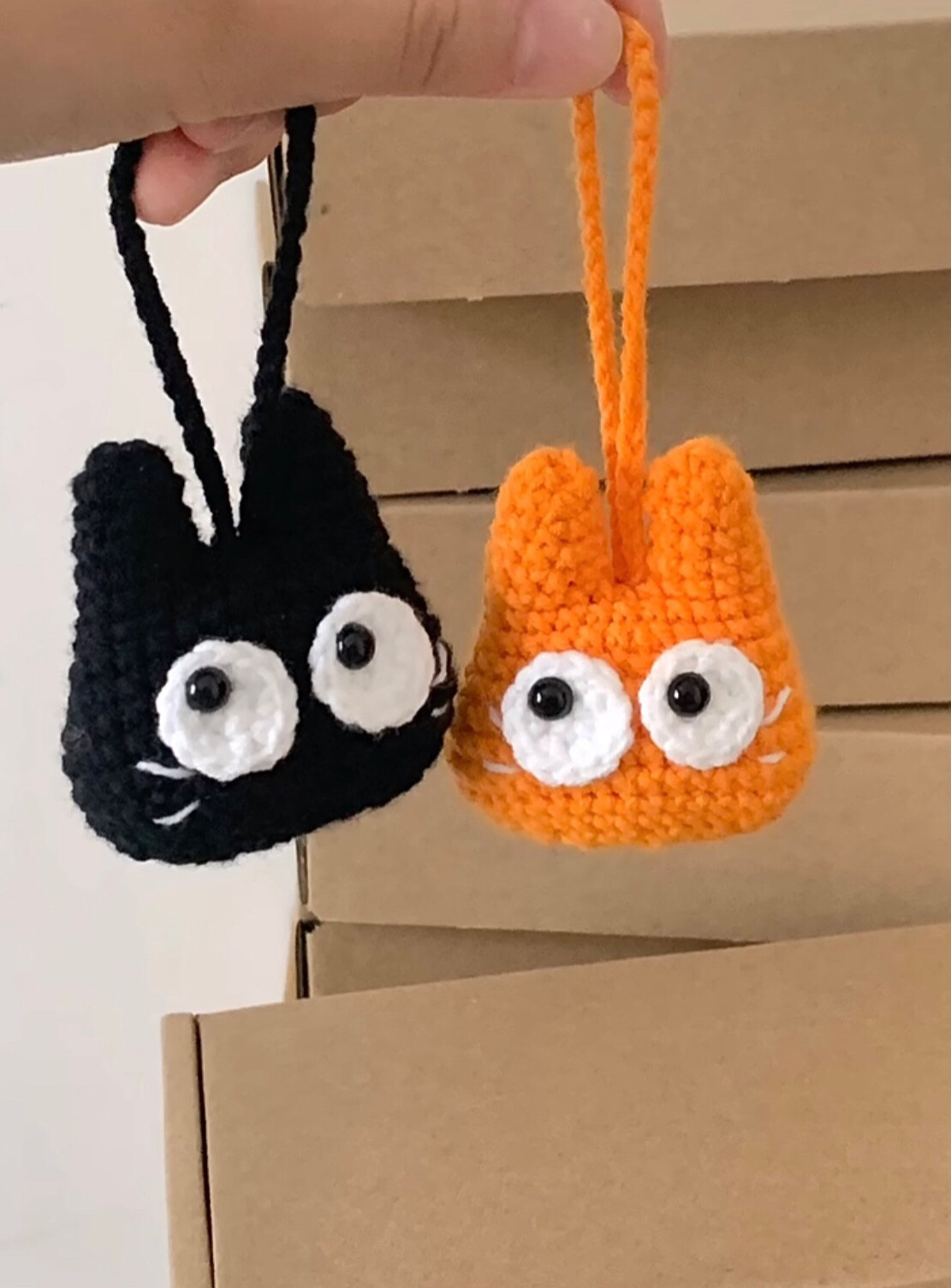Black cat keychain with white eyes.crochet patterns