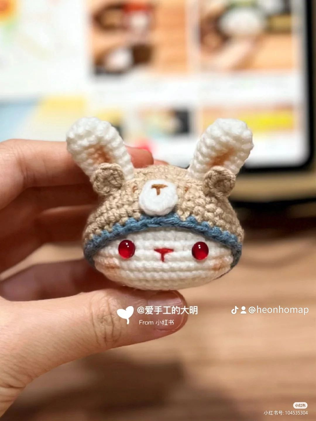 Doll head wearing crochet rabbit hat pattern