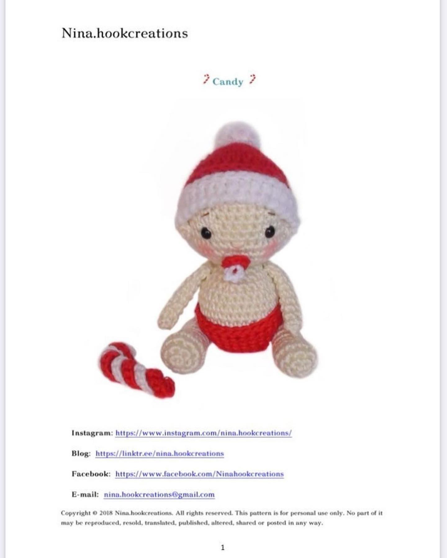 Crochet pattern for a baby holding a pacifier and wearing a red hat