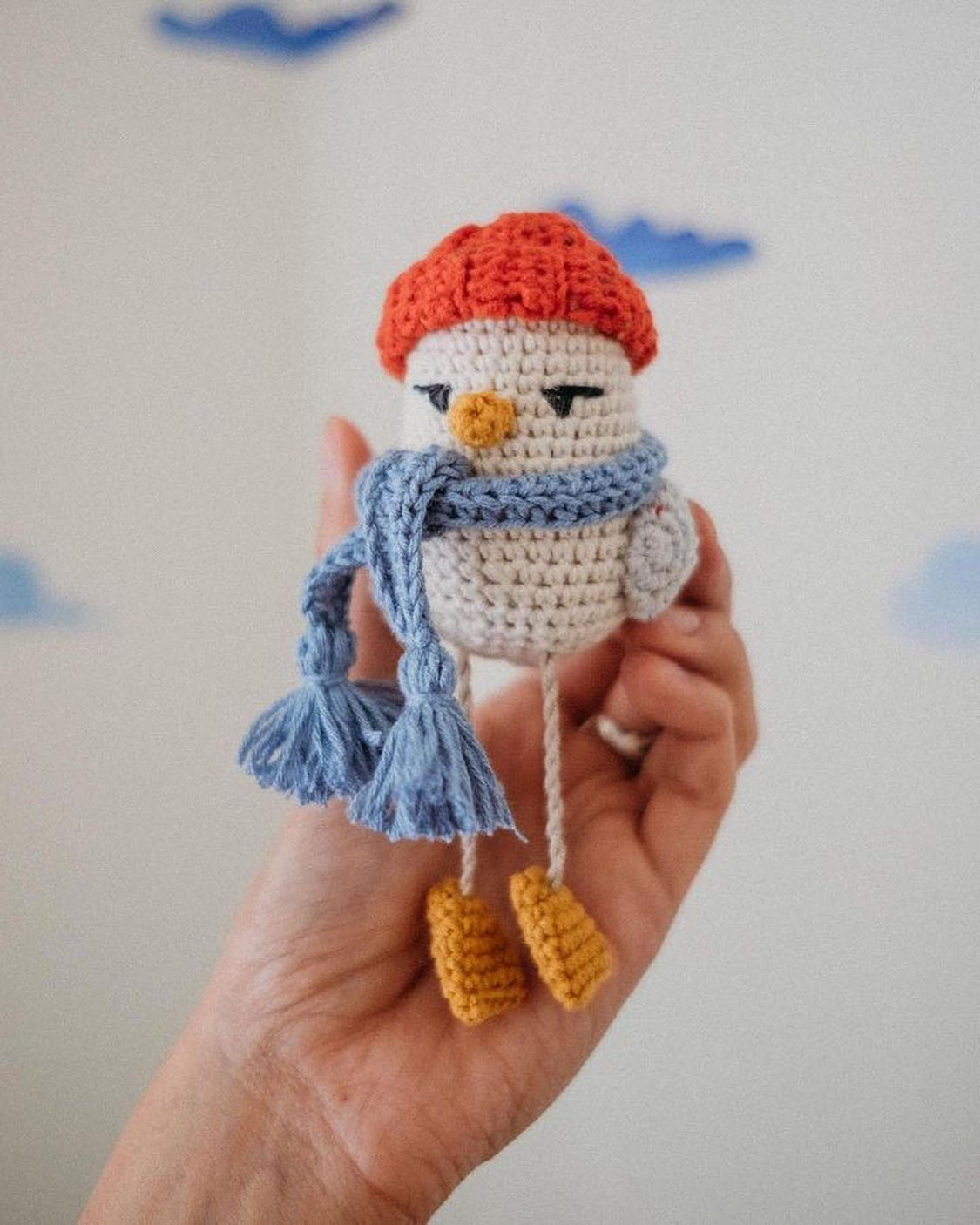 Crochet pattern for a chicken wearing a hat and scarf.