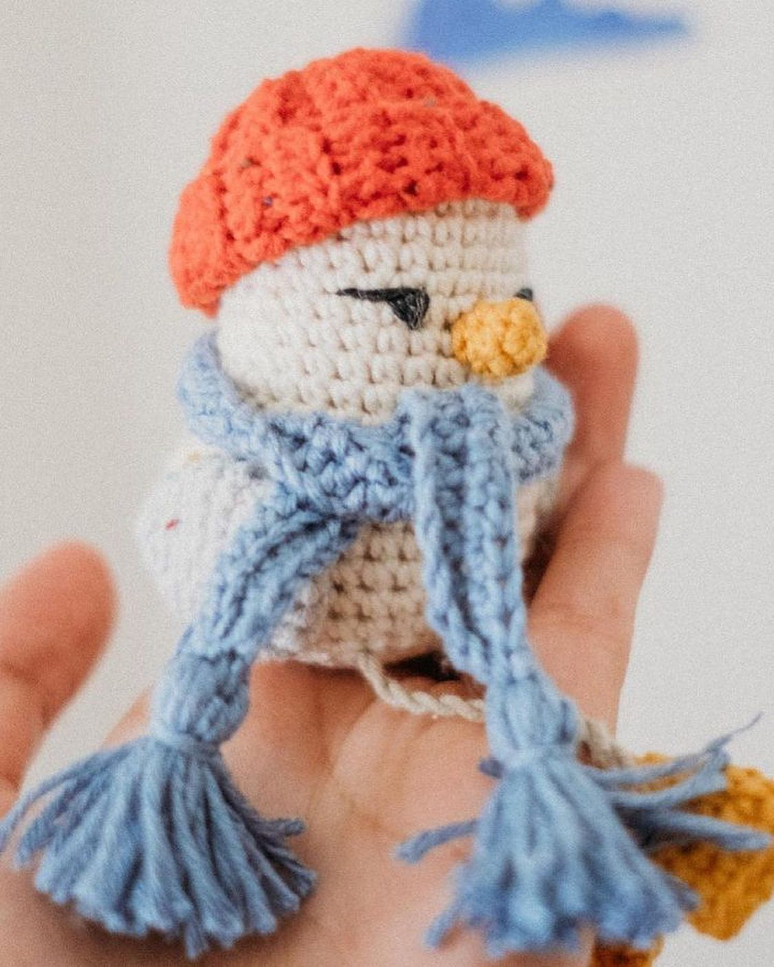 Crochet pattern for a chicken wearing a hat and scarf.