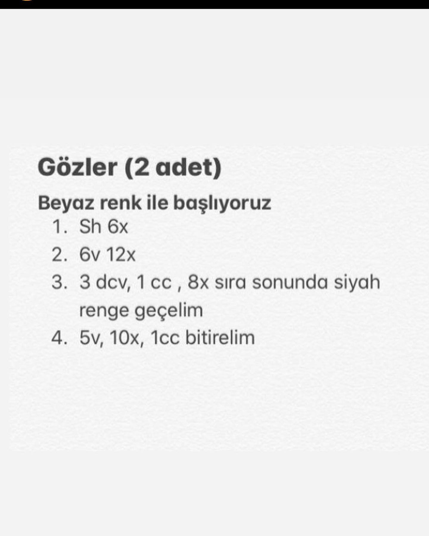 Beyaz ve turuncu kedi yüzü tığ işi modeli.