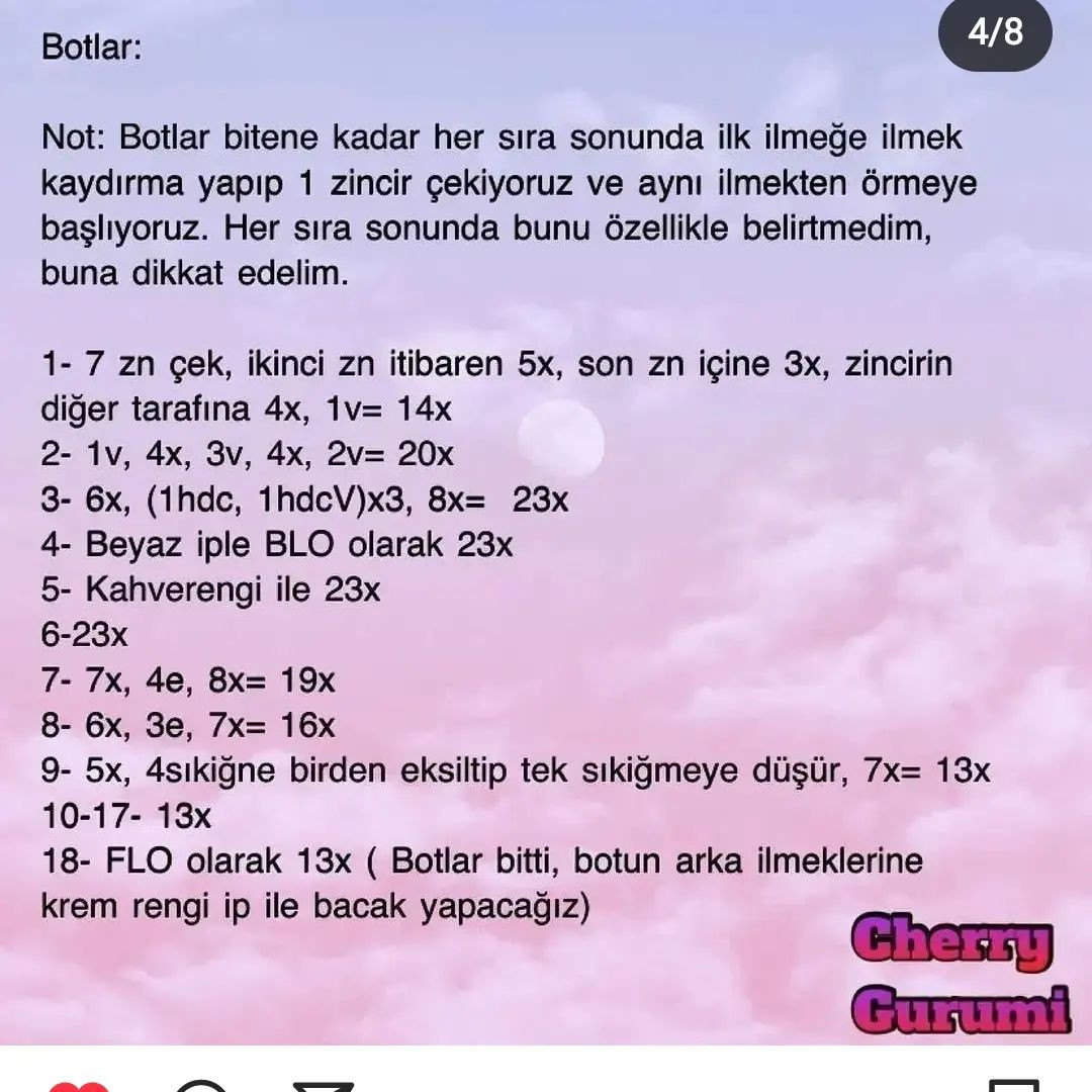 Pembe elbise ve kıyafet giyen bir tavşan için tığ işi modeli.