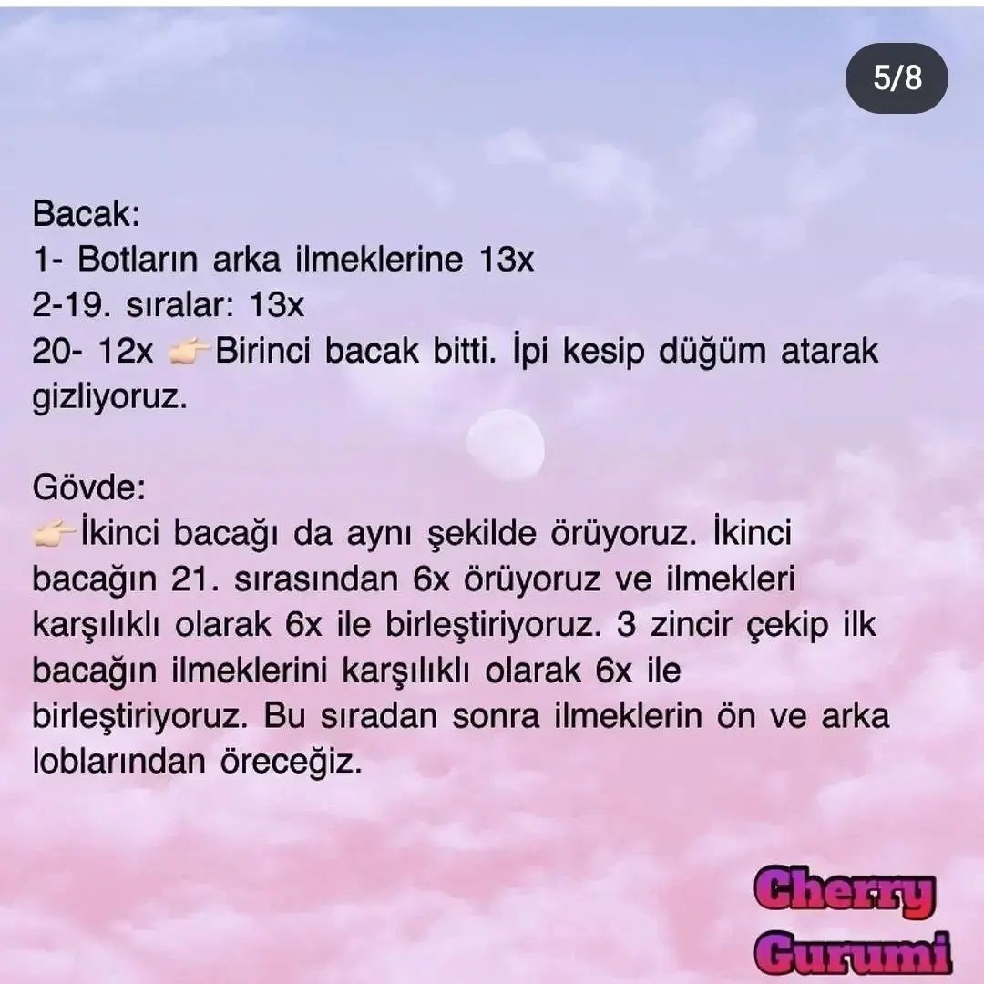 Pembe elbise ve kıyafet giyen bir tavşan için tığ işi modeli.