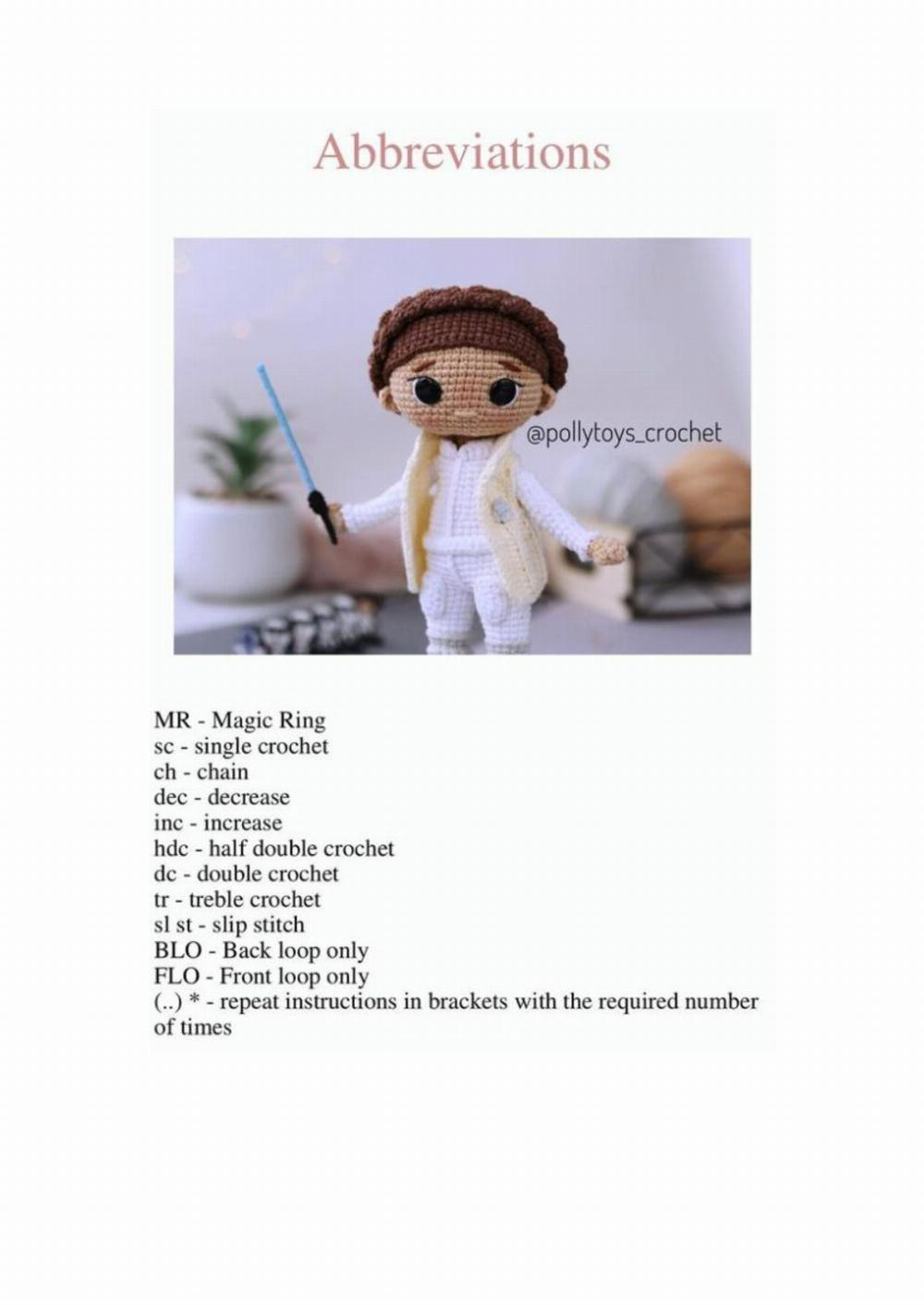 Crochet pattern for a boy doll wearing a hat and holding a sword