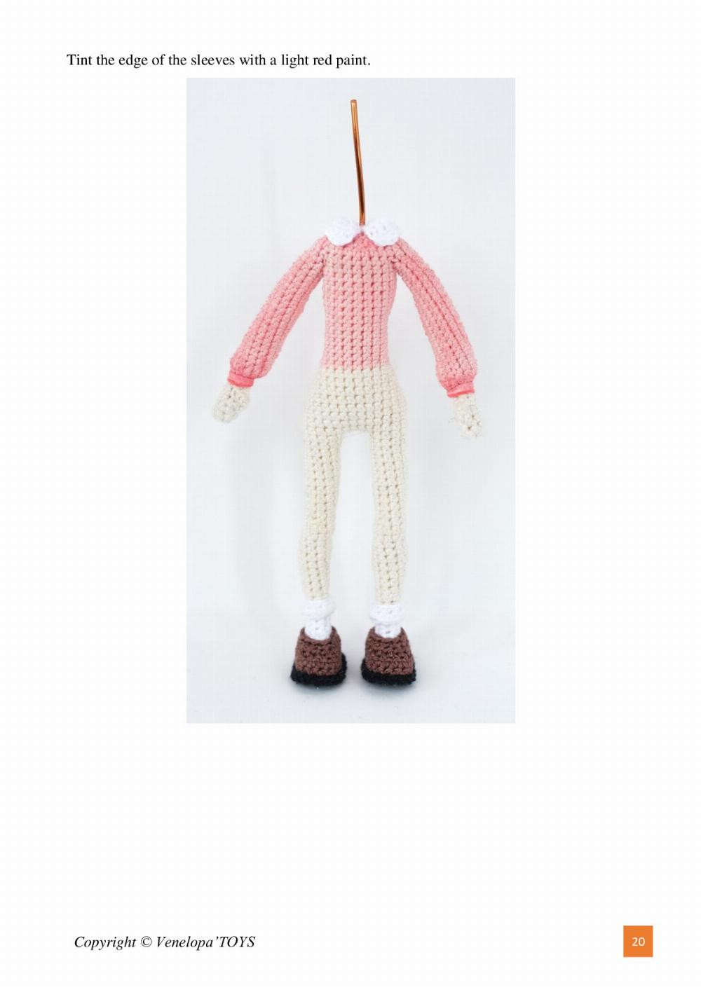 Crochet pattern for baby girl doll wearing overalls, long hair, and hairband.