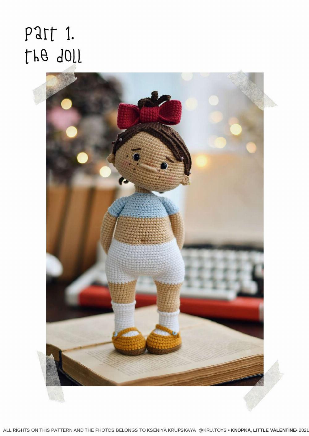 crochet pattern KNOPKA, THE little vALENTINE, Crochet pattern for a little girl doll wearing a blue dress holding a heart-shaped balloon