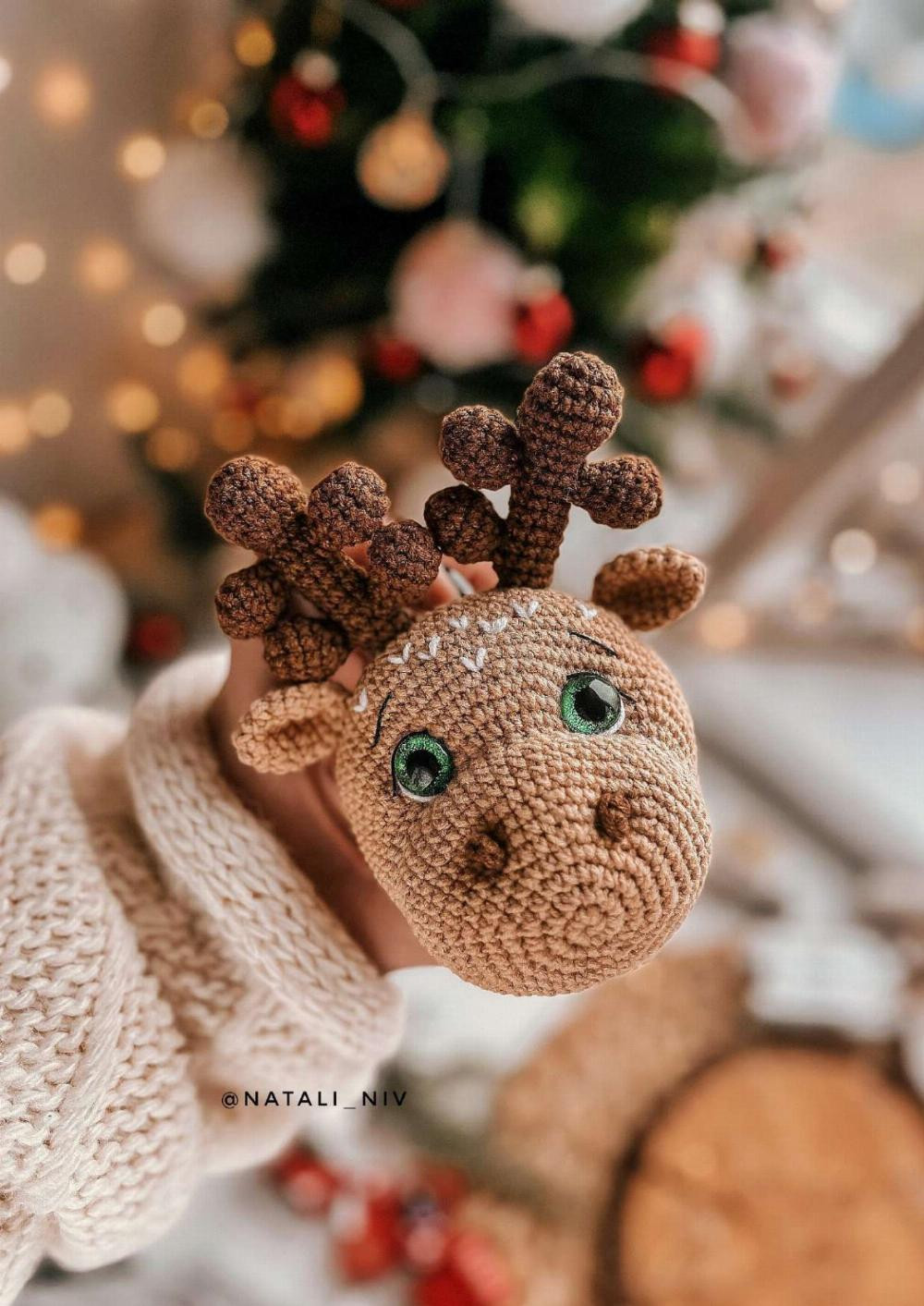 Crochet pattern of a deer wearing clothes and a scarf