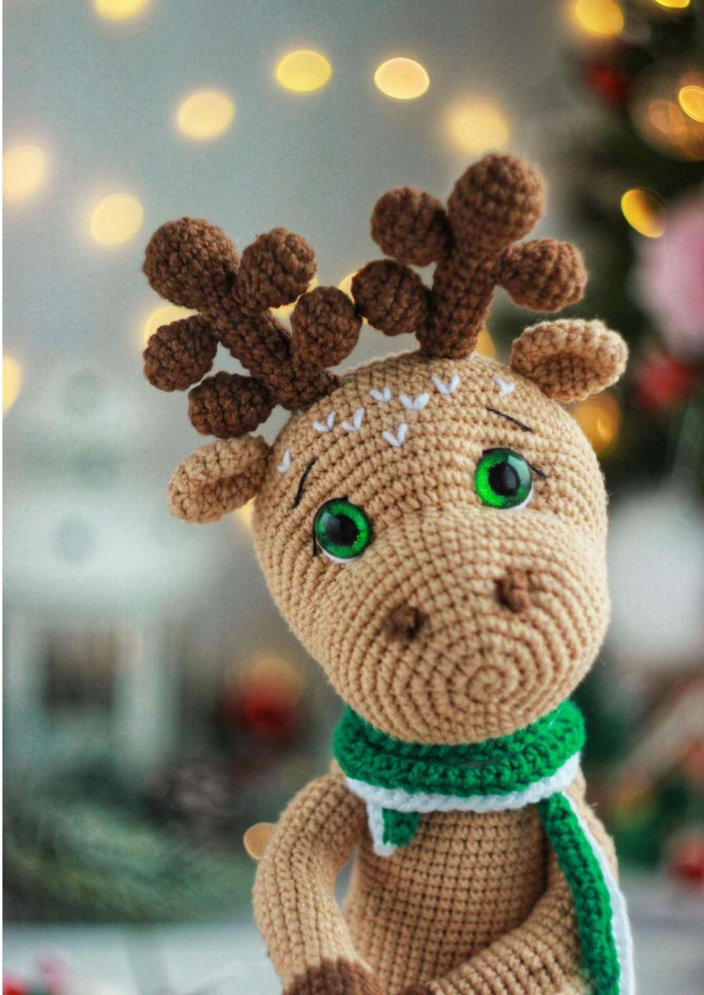 Crochet pattern of a deer wearing clothes and a scarf