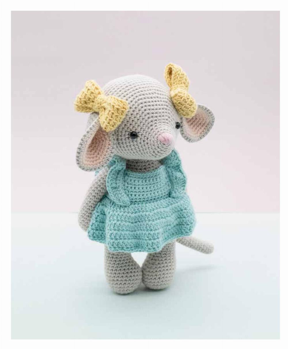 Hattie Crochet pattern of a mouse wearing a blue dress and yellow bow