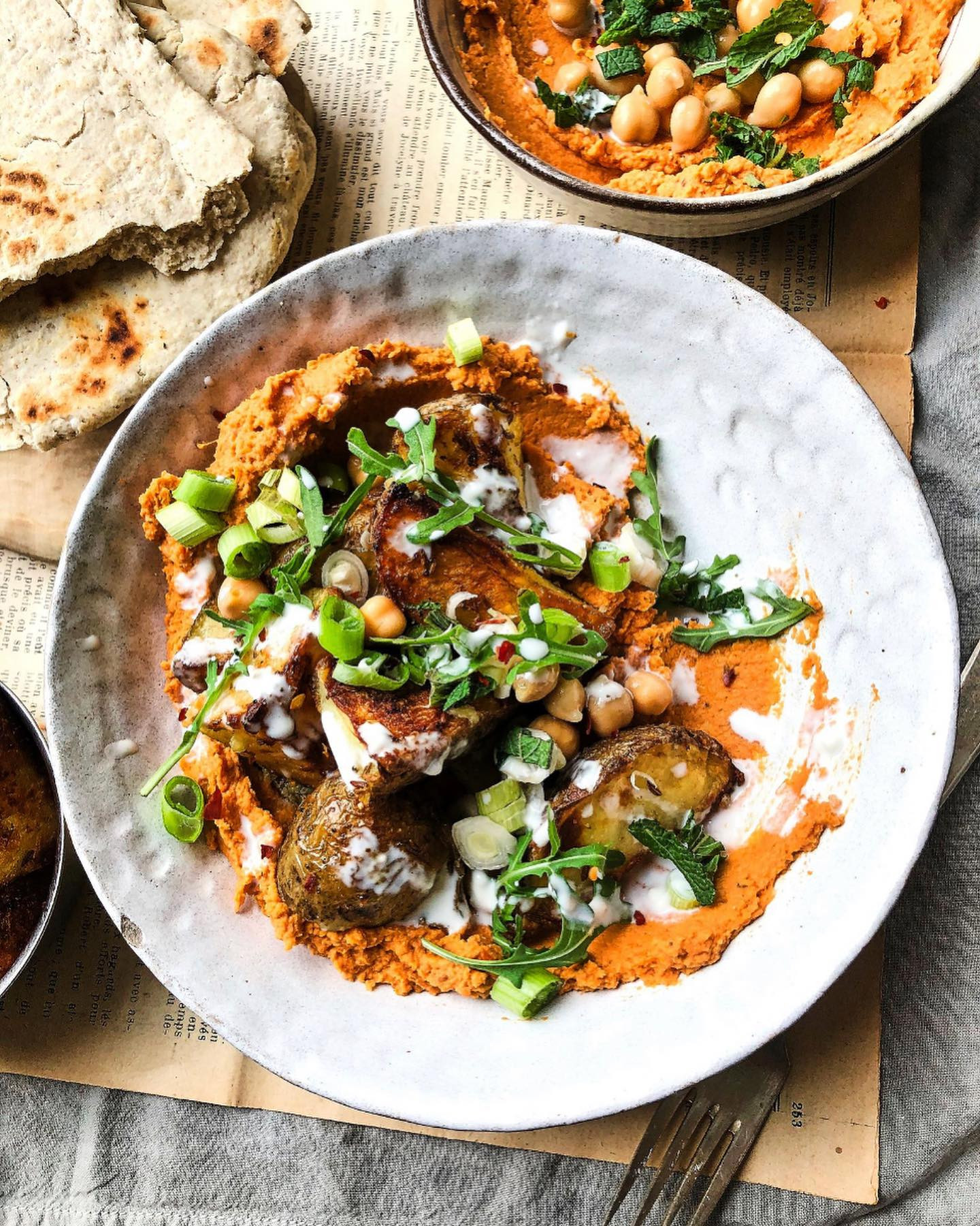 Crispy potatoes with harissa hummus and flatbread - a simple but delicious meal