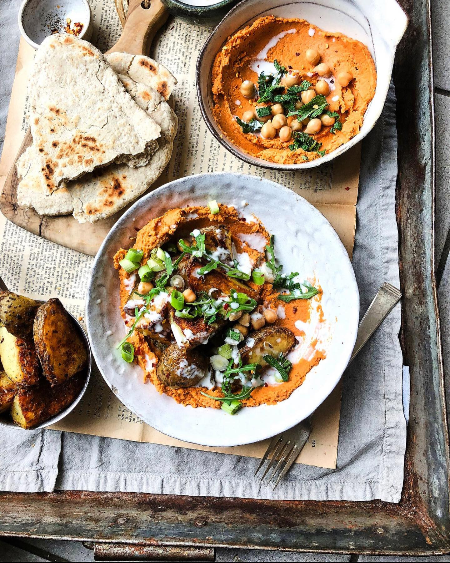 Crispy potatoes with harissa hummus and flatbread - a simple but delicious meal