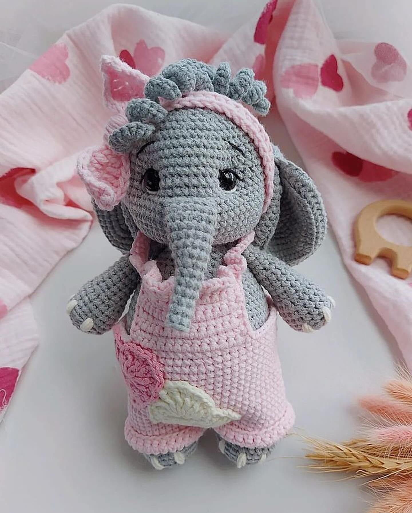 Gray elephant crochet pattern wearing pink dress