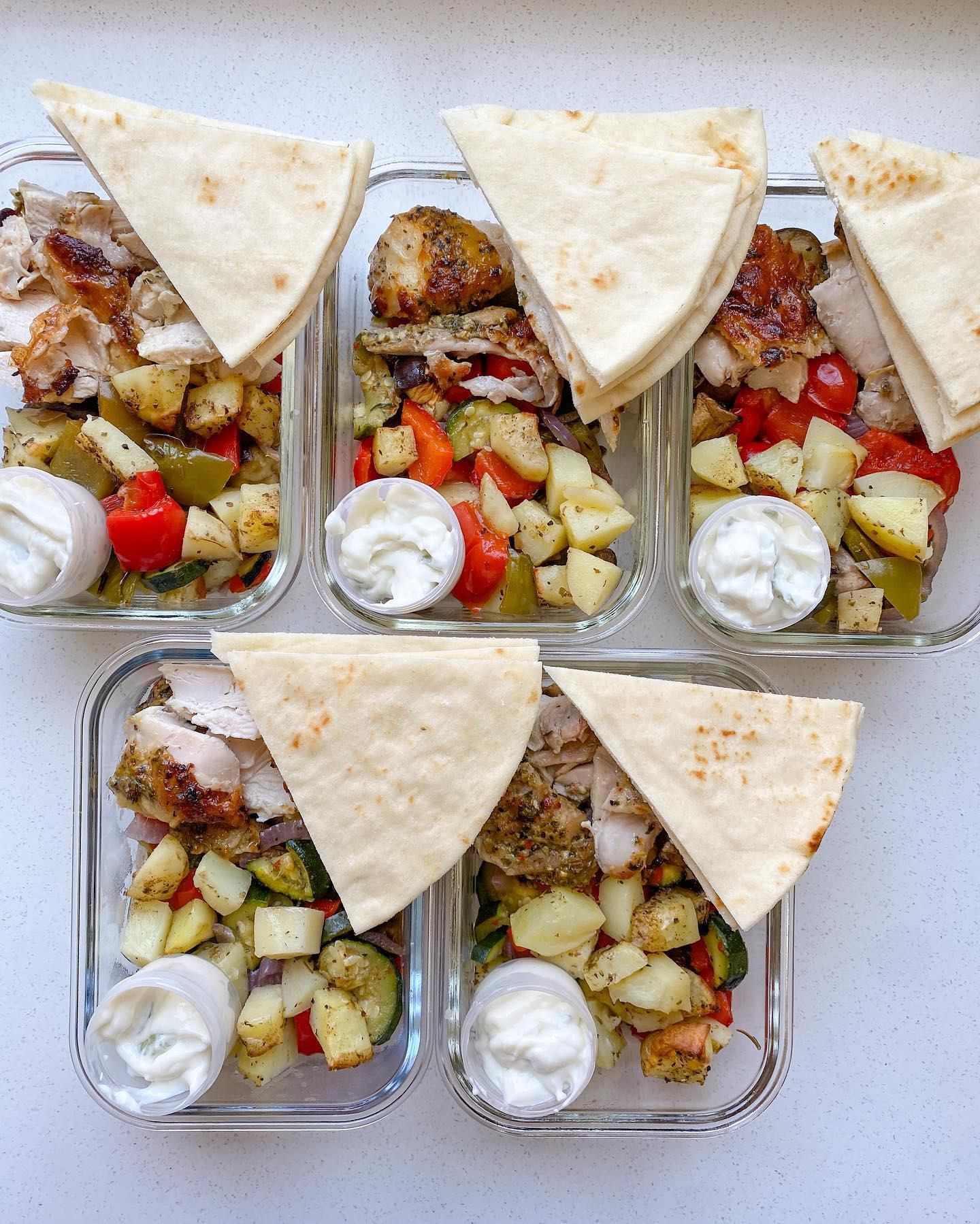 Greek chicken with roast veggies, tzatziki mayo and pita bread! Loved it.