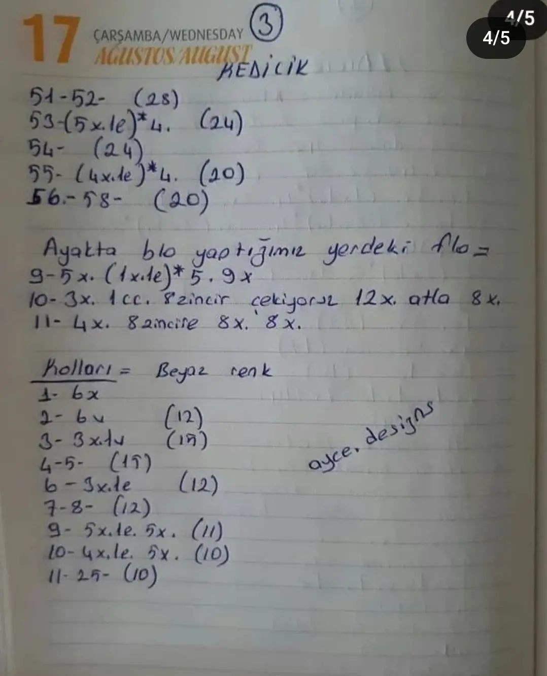 Mor elbise giyen beyaz bir kedinin tığ işi modeli.