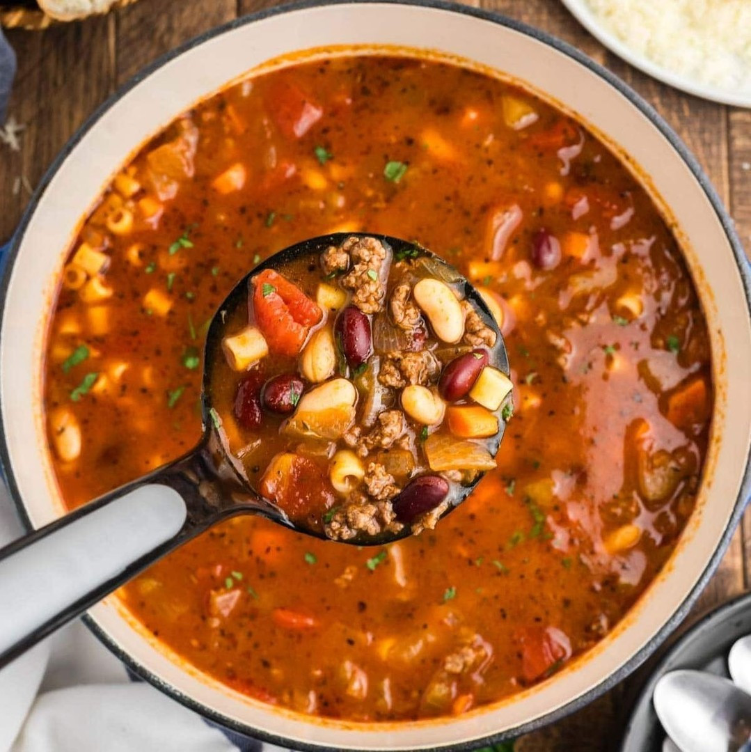 Pasta e Fagioli Soup is an Olive Garden copycat recipe and an Italian favorite. Loaded with beans, ground beef, and tiny noodles, this soup is so comforting, and it's made all in one pot!⁠