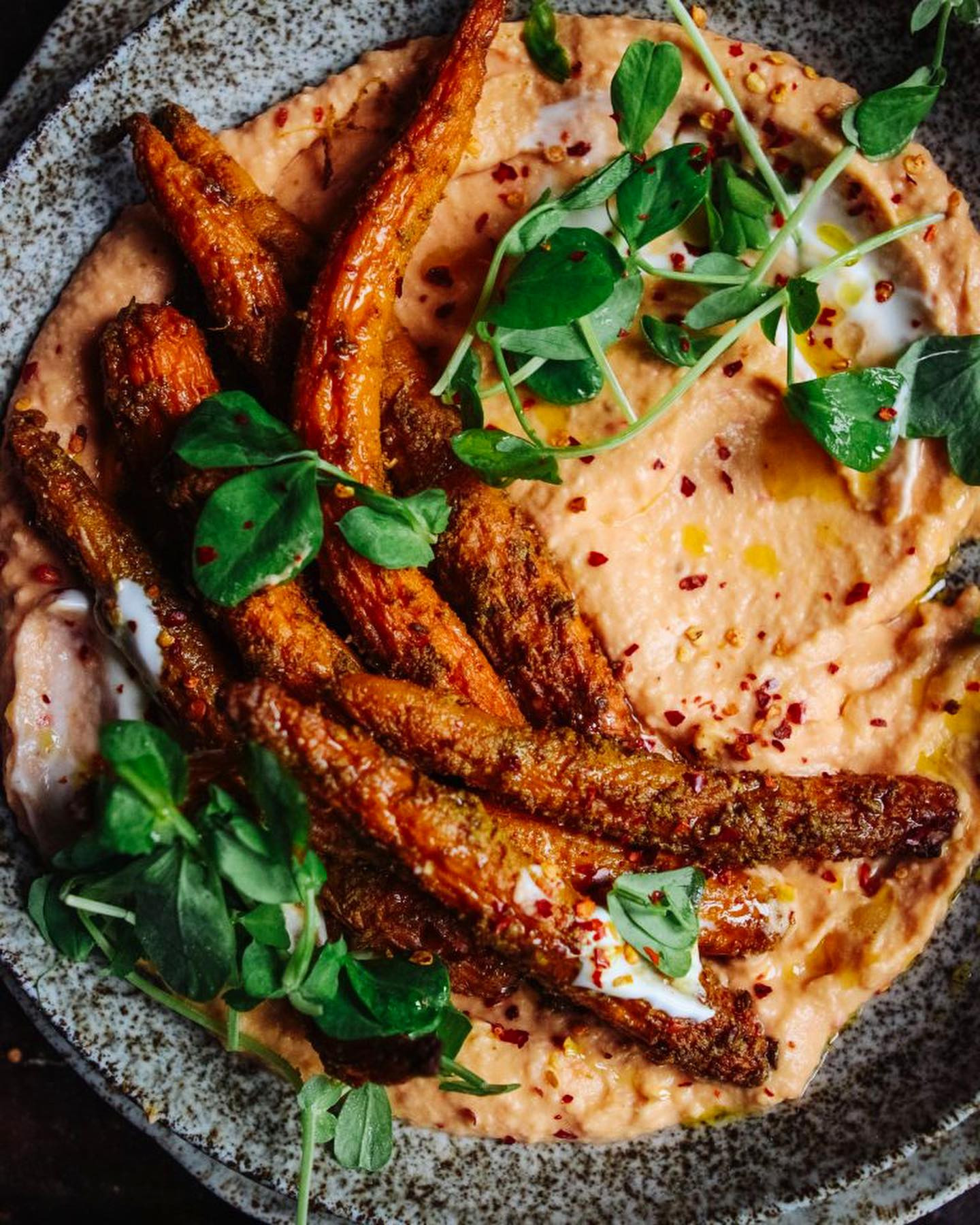 Spiced roast carrots on butter bean & tomato mash! ❤️