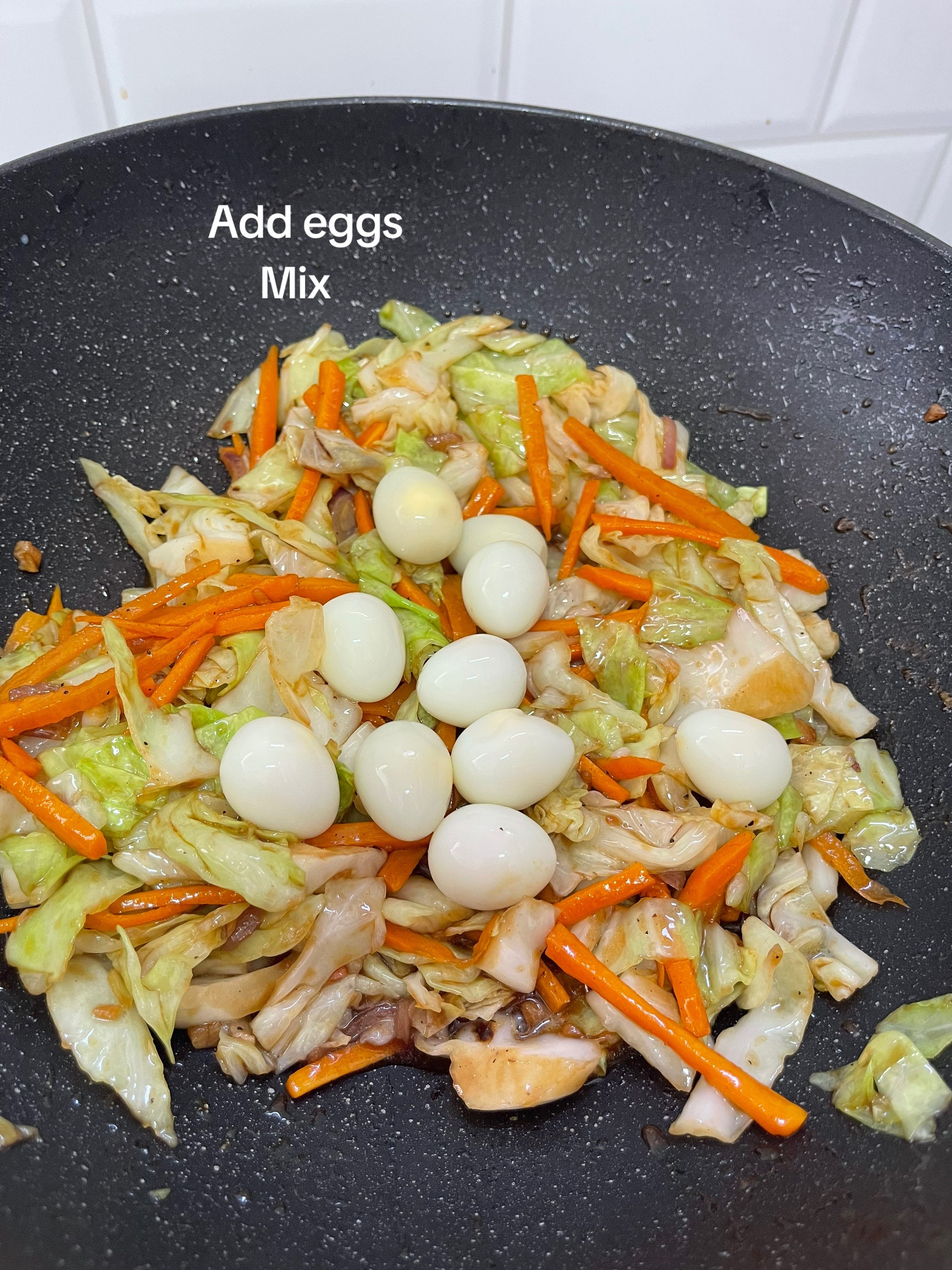 stir fry cabbage & carrots with quail eggs