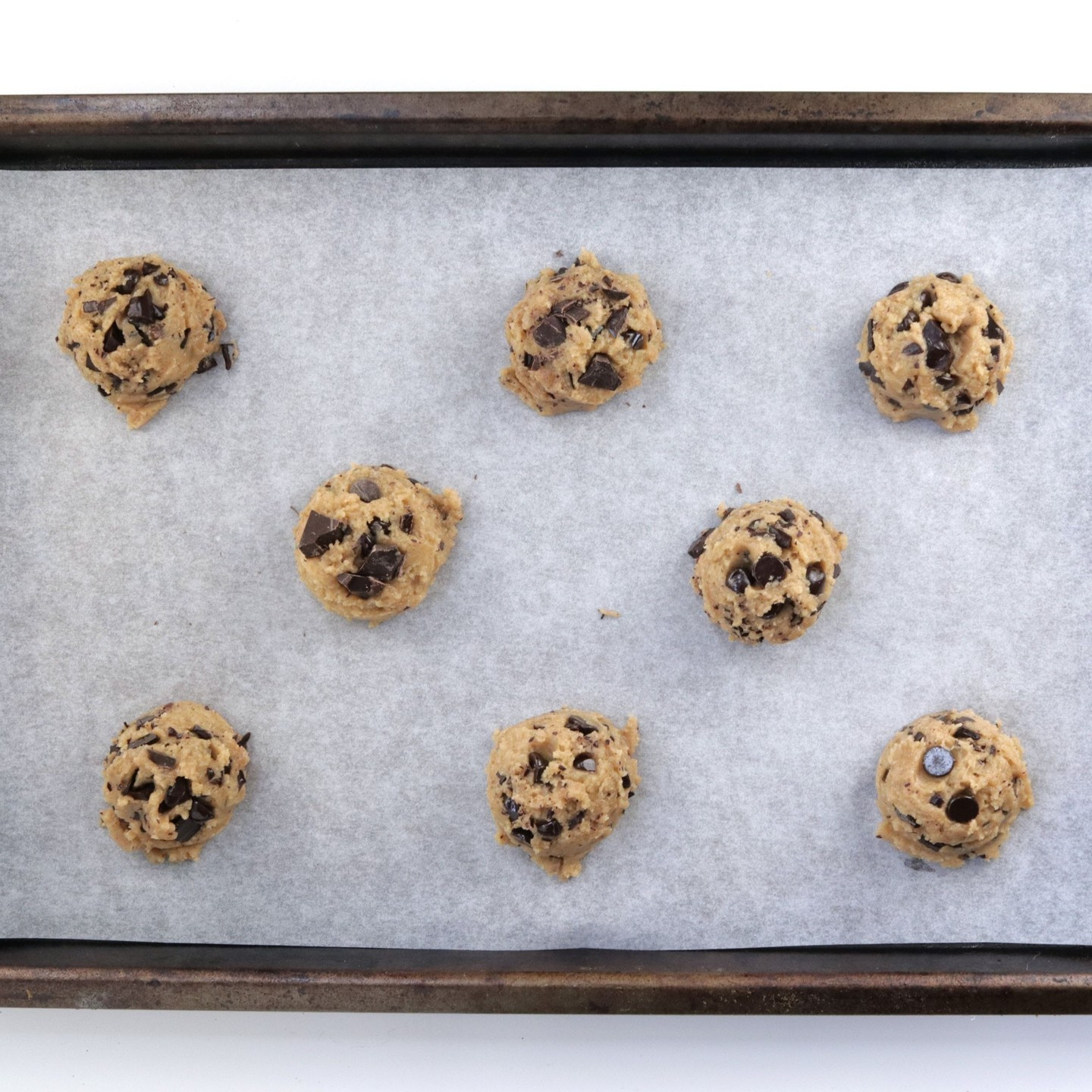 These are hands down the best vegan chocolate chip cookies you will ever make! They are crispy on the outside, and perfectly chewy! They are sweet (but not too sweet), buttery, and oozing with melty chocolate.