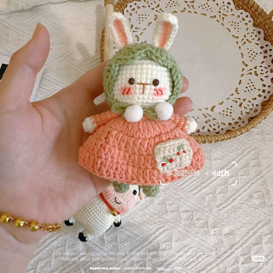 crochet rabbit wearing dress and hood