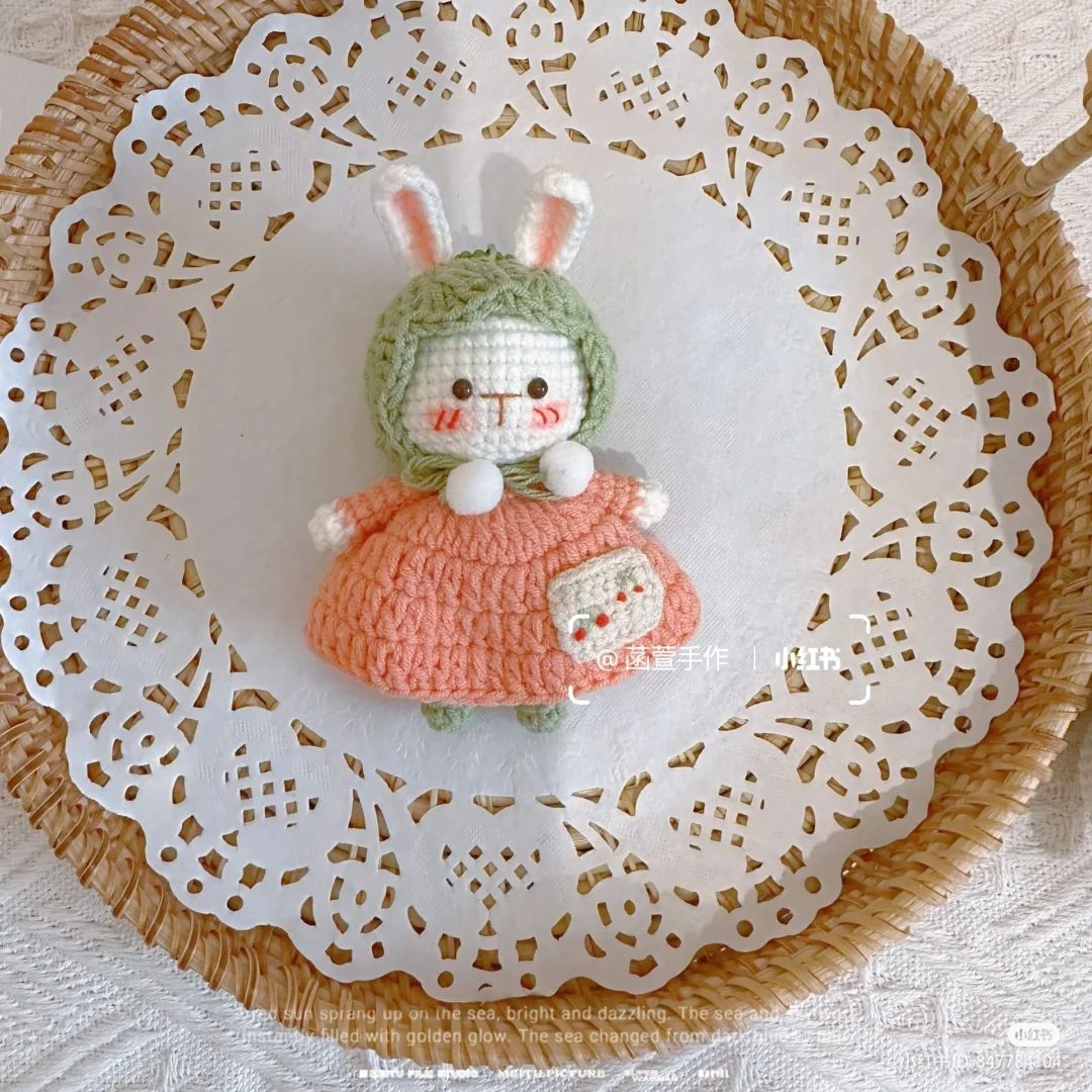 crochet rabbit wearing dress and hood