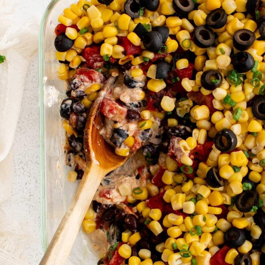 This Layered Tex-Mex Dip is full of so many layers of flavor starting with the creamy, spicy sour cream and cream cheese base, topped with cheese, black beans, corn, green onions, and fire roasted tomatoes.⁠