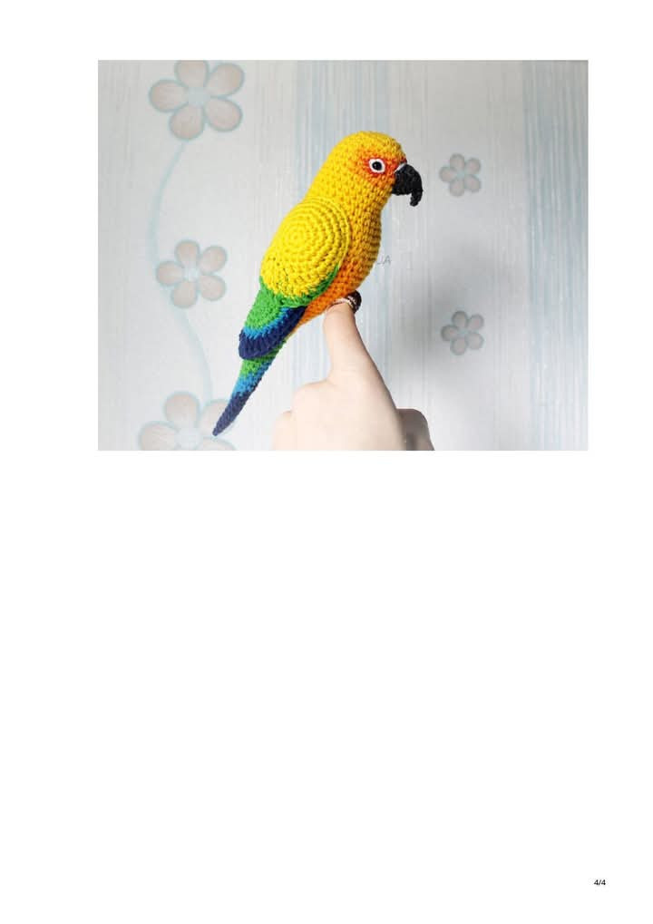 Patrón de ganchillo para crear un colorido periquito amigurumi con instrucciones detalladas