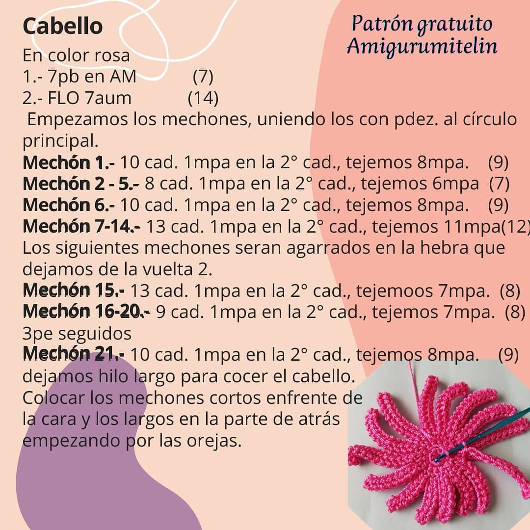 Patrón de muñeco Amigurumi de figura con cabello rosa y suéter a rayas.