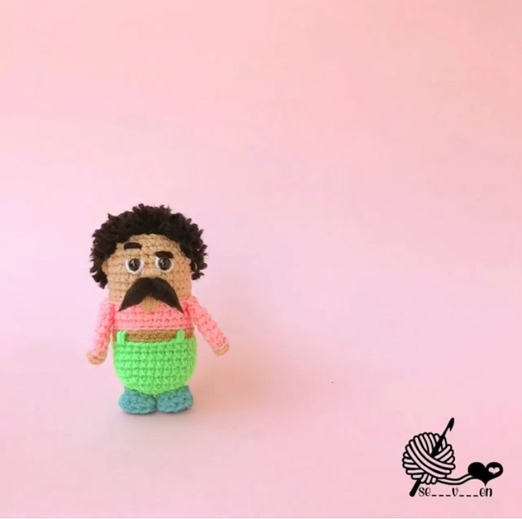 Cute Crochet Doll with Bright Green Overalls and Mustache