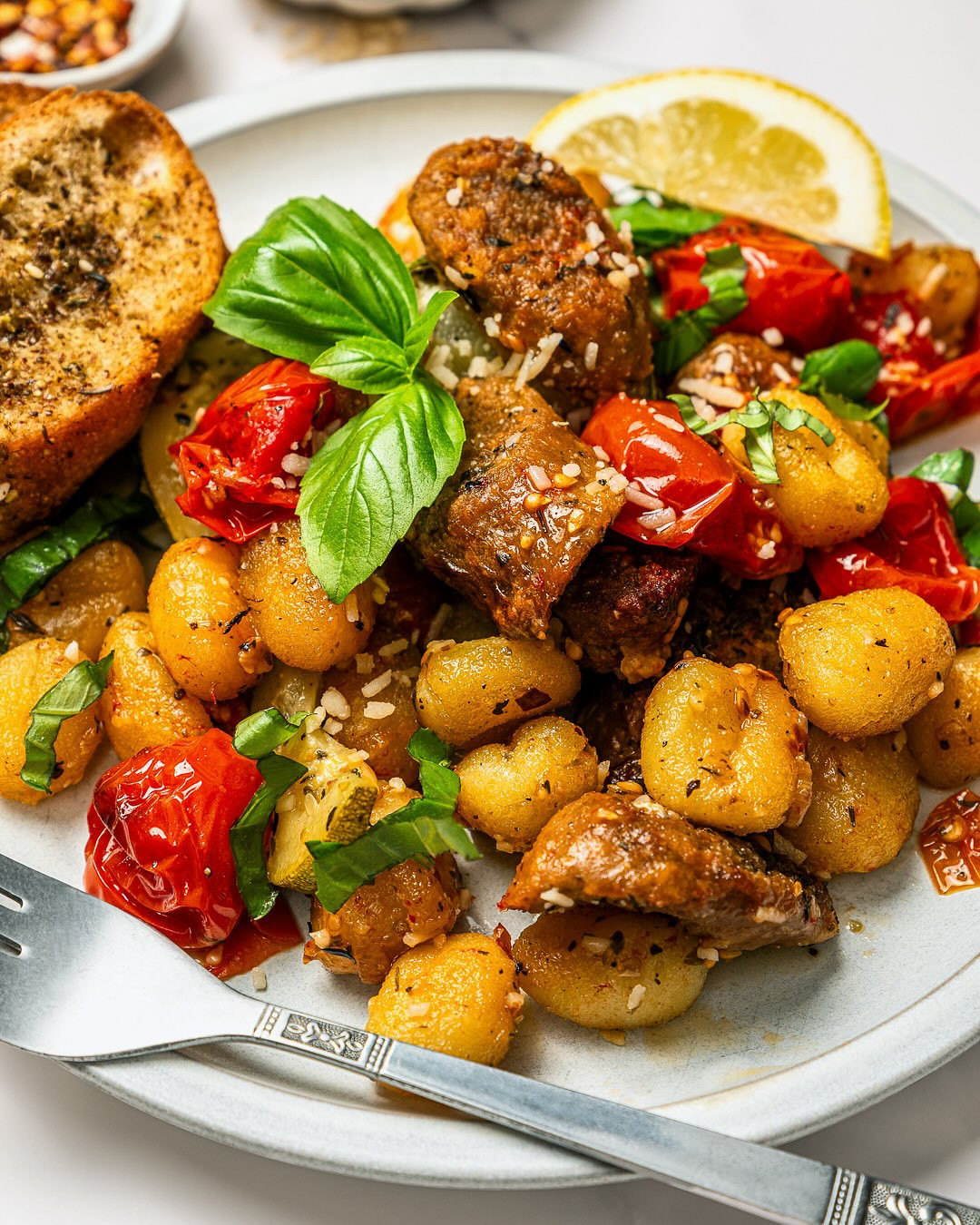 Golden Vegan Gnocchi with Herbed Sausage and Caramelized Vegetables