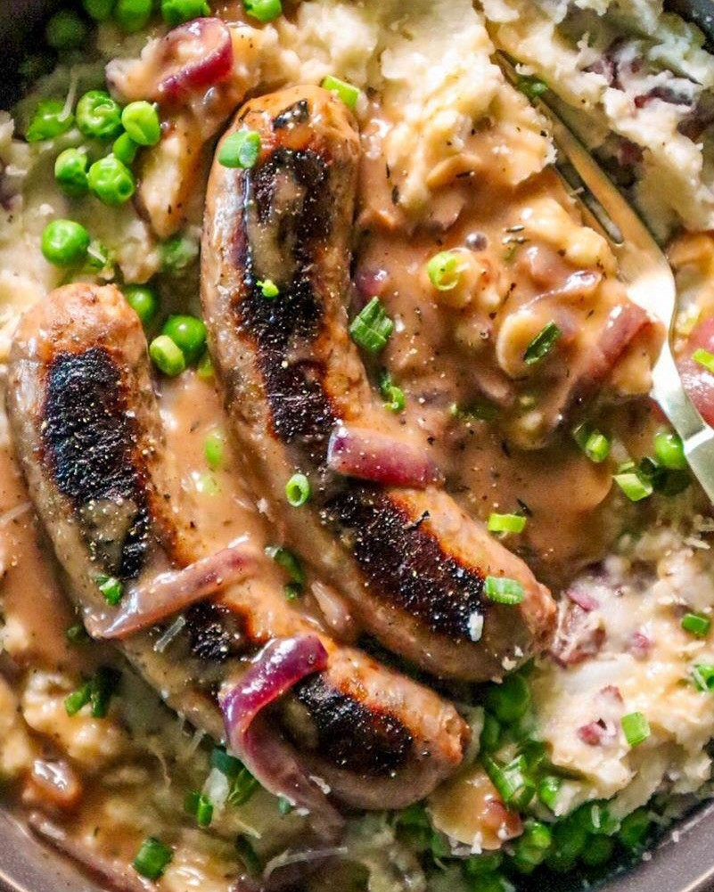 Savory Sausages with Cheddar Mash and Onion Gravy Delight
