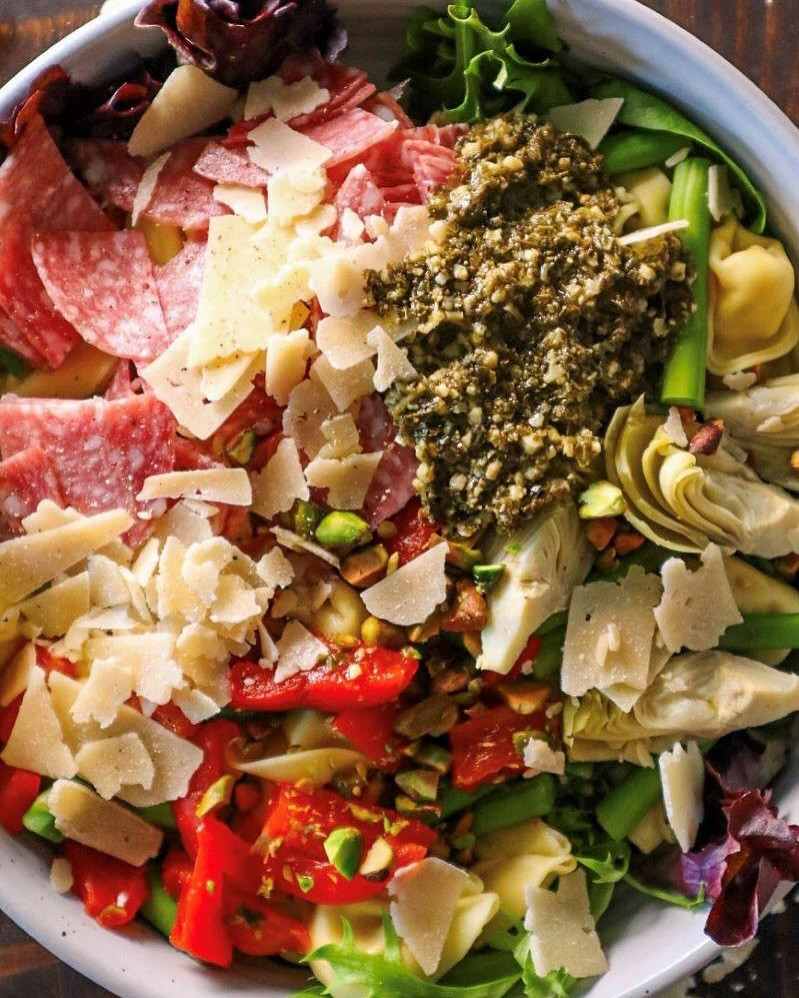 Vibrant Pesto Tortellini Delight with Salami and Pistachios