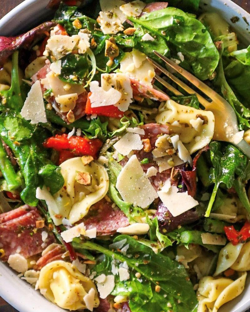 Vibrant Pesto Tortellini Delight with Salami and Pistachios