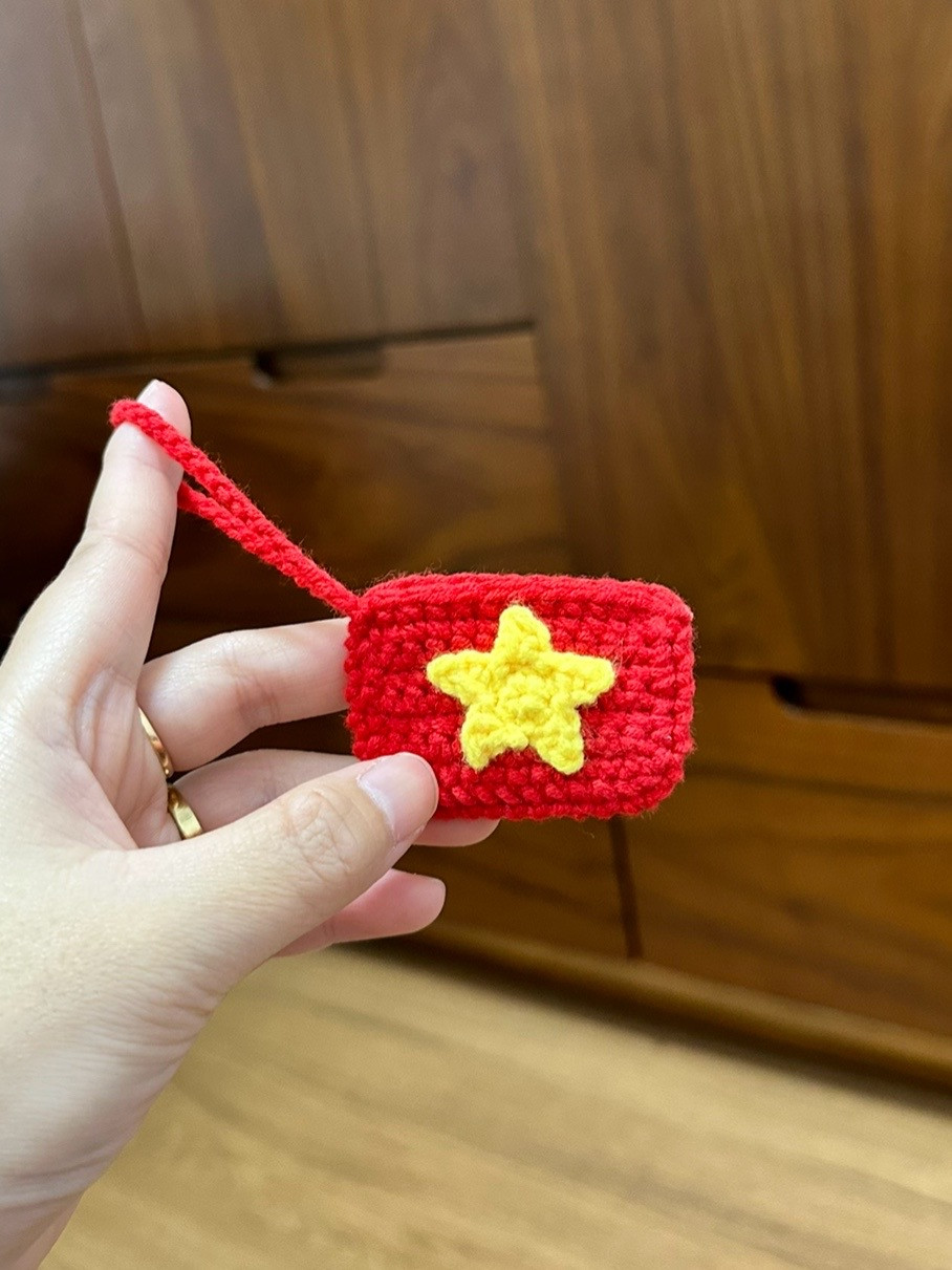 Crochet Keychain with Yellow Star Pattern on Red Background