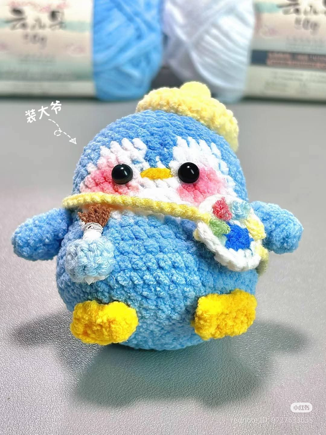 Cute Crochet Penguin Artist with Yarn and Accessories